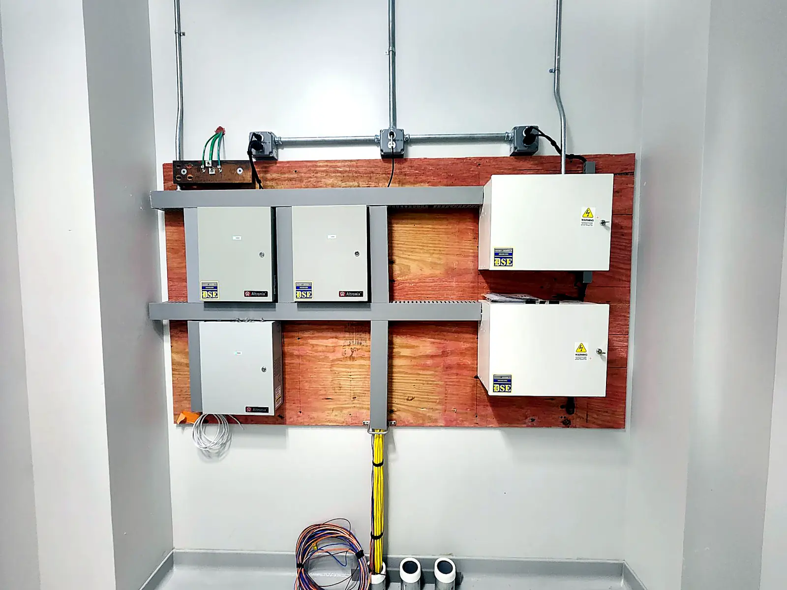 Retrofitted commercial door access control system for existing doors