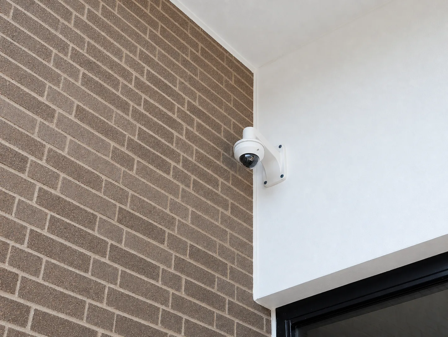 DSE commercial surveillance camera professionally installed at a Michigan business entrance